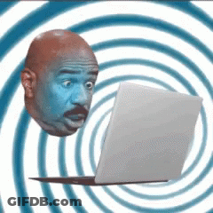 A Man 'S Head Is Floating Above A Laptop Computer GIF