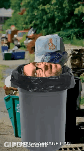 A Man 'S Head Is In A Garbage Can That Says Human Garbage Can On The Bottom GIF