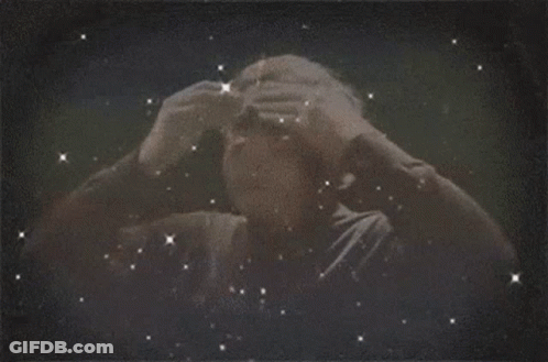 A Man 'S Head Is Surrounded By Lightning Bolts GIF