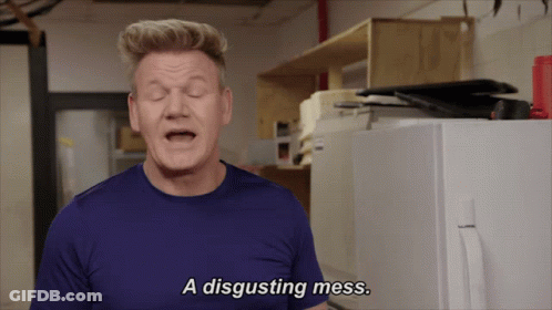 A Man Says A Disgusting Mess In Front Of A White Refrigerator GIF