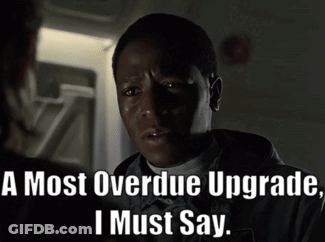 A Man Says " A Most Overdue Upgrade I Must Say " In A Dark Room GIF