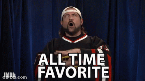 A Man Says All Time Favorite With His Hands Up In The Air GIF