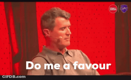 A Man Says Do Me A Favour In Front Of A Red Wall GIF