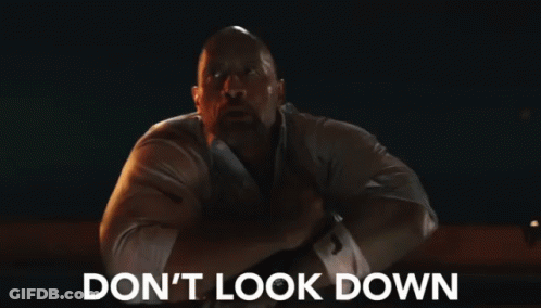A Man Says " Don 'T Look Down " While Looking Down GIF