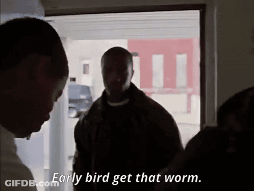 A Man Says Early Bird Get That Worm While Standing In A Doorway GIF