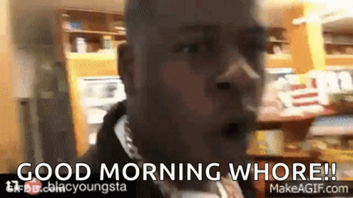 A Man Says Good Morning Whore In Front Of A Kitchen GIF