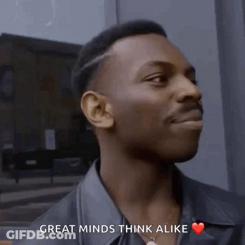 A Man Says Great Minds Think Alike And Has A Heart On His Chest GIF