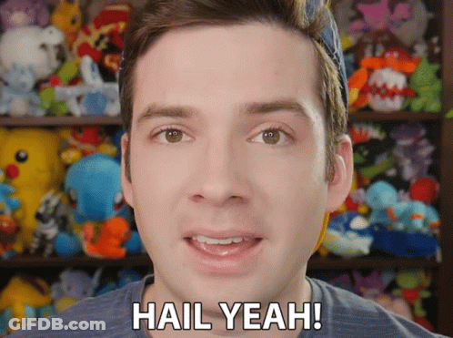 A Man Says Hail Yeah In Front Of A Stuffed Animal Shelf GIF
