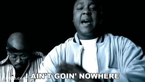 A Man Says I Ain 'T Goin ' Nowhere While Another Man Looks On GIF