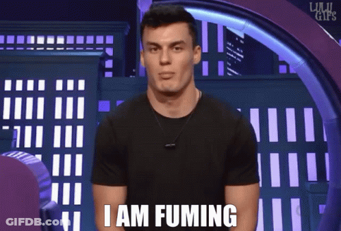 A Man Says I Am Fuming In Front Of A City Background GIF