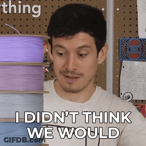 A Man Says " I Didn 'T Think We Would " In Front Of A Stack Of Spools Of Wire GIF
