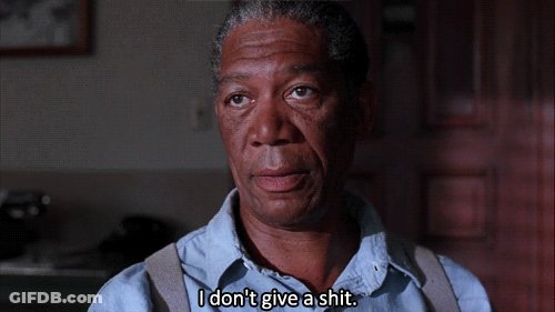 A Man Says " I Don 'T Give A Shit " In Front Of A Door GIF