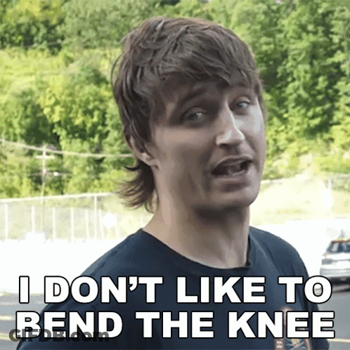 A Man Says " I Don 'T Like To Bend The Knee " While Wearing A Black Shirt GIF
