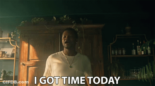 A Man Says I Got Time Today In Front Of A Wooden Cabinet GIF
