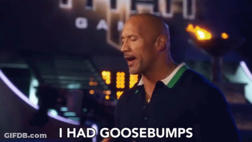 A Man Says I Had Goosebumps In Front Of A Sign GIF