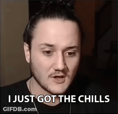 A Man Says I Just Got The Chills In Front Of A Black Background GIF