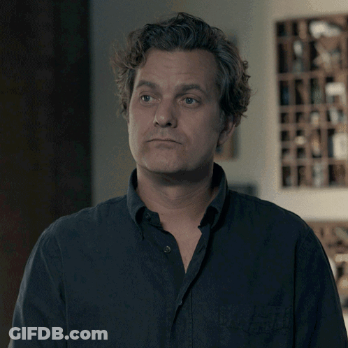 A Man Says I 'Ll Take It In Front Of A Wine Shelf GIF