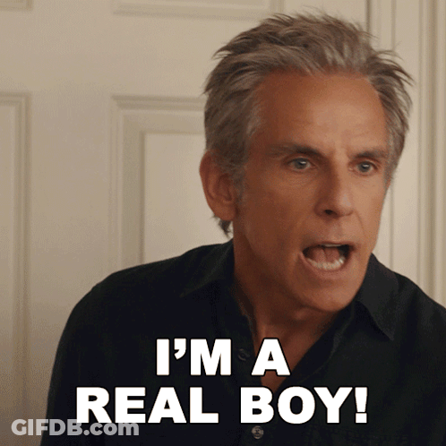 A Man Says I 'M A Real Boy In Front Of A Door GIF