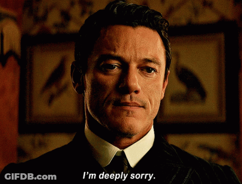 A Man Says I 'M Deeply Sorry In A Dark Room GIF