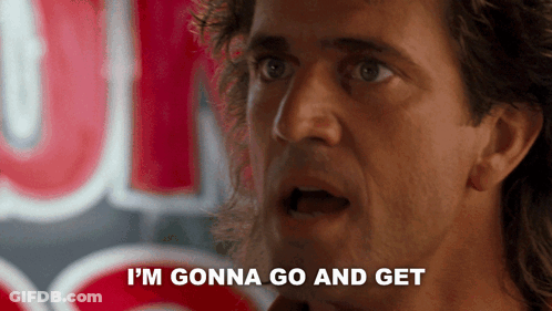A Man Says " I 'M Gonna Go And Get " In Front Of A Neon Sign GIF