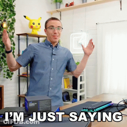 A Man Says I 'M Just Saying In Front Of A Desk GIF