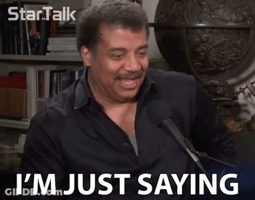 A Man Says I 'M Just Saying While Speaking Into A Microphone GIF