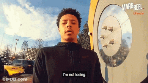 A Man Says I 'M Not Losing In Front Of A Mars Reel Clock GIF