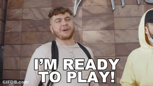 A Man Says I 'M Ready To Play In Front Of A Wooden Wall GIF