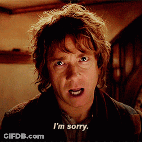 A Man Says I 'M Sorry In Front Of A Staircase GIF