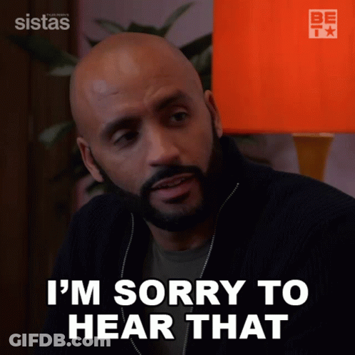 A Man Says I 'M Sorry To Hear That In Front Of An Orange Lamp GIF