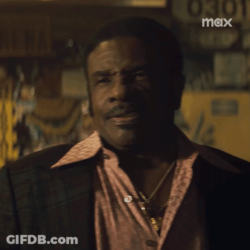 A Man Says I 'M Staying In Front Of A Sign That Says Max GIF