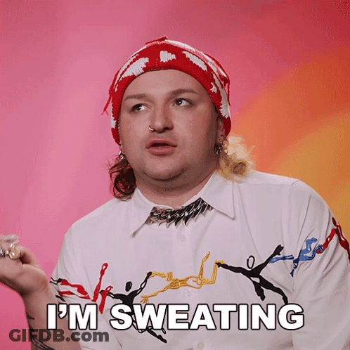 A Man Says I 'M Sweating While Wearing A Red Hat GIF