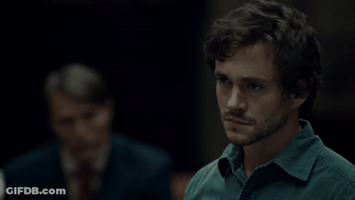 A Man Says " I Thought About It " In A Dark Room GIF