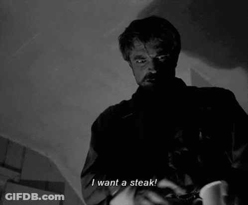 A Man Says I Want A Steak In A Black And White Scene GIF