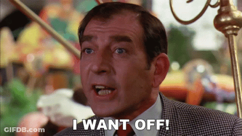 A Man Says " I Want Off " In Front Of A Carousel GIF