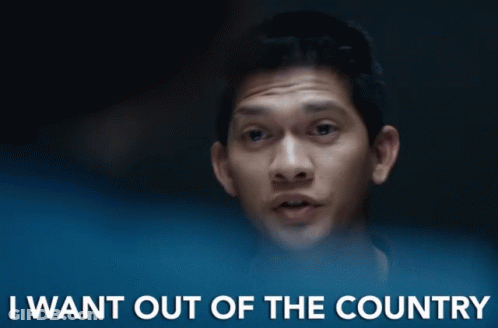 A Man Says " I Want Out Of The Country " In Front Of A Dark Background GIF