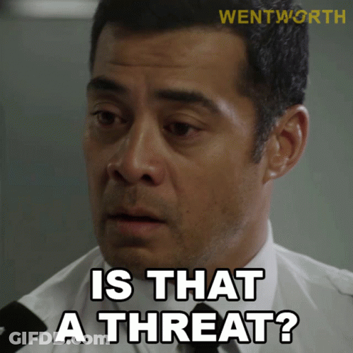 A Man Says " Is That A Threat " While Wearing A White Shirt And Black Tie GIF