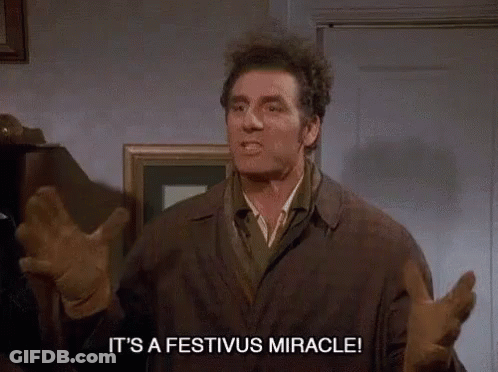 A Man Says It 'S A Festivus Miracle While Standing In A Room GIF