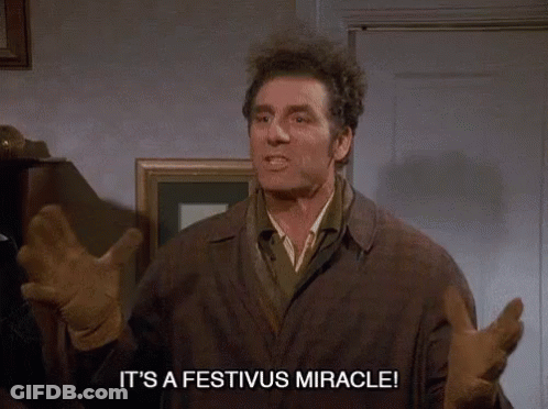 A Man Says It 'S A Festivus Miracle While Standing In A Room GIF