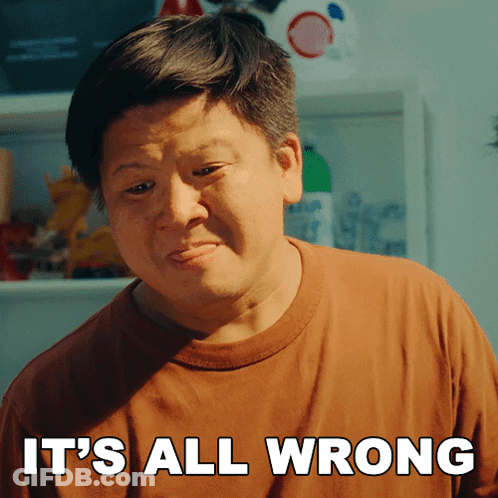 A Man Says It 'S All Wrong In Front Of A Shelf GIF