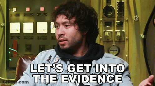 A Man Says Let 'S Get Into The Evidence While Sitting In Front Of A Panel GIF