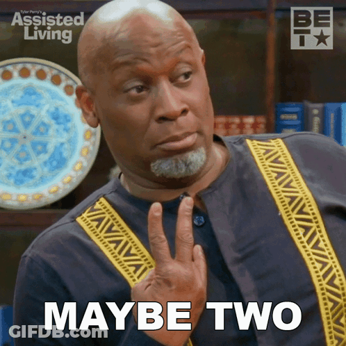 A Man Says Maybe Two In Front Of An Assisted Living Poster GIF