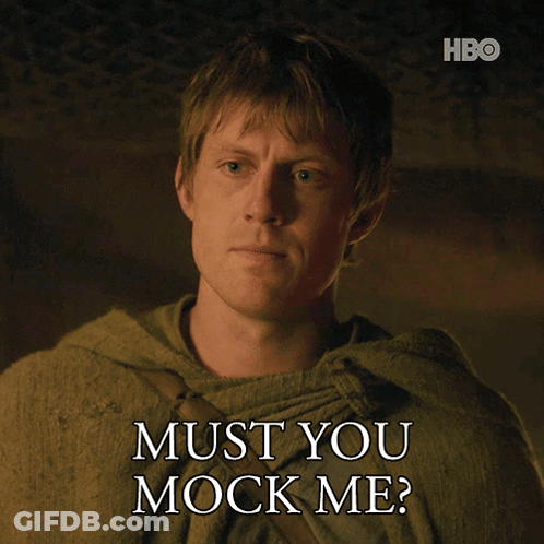 A Man Says " Must You Mock Me " While Wearing A Green Cloak GIF