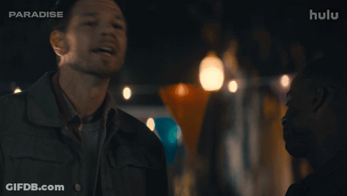 A Man Says " Nunya Business " In Front Of A Hulu Logo GIF