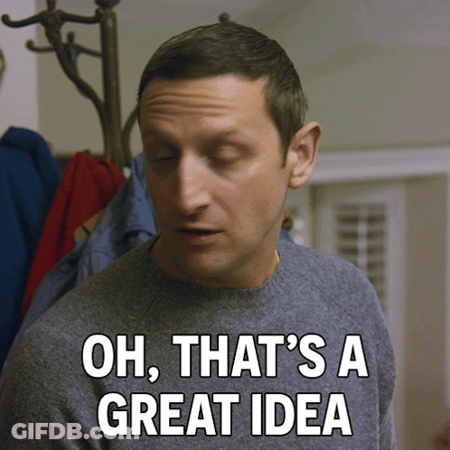 A Man Says Oh That 'S A Great Idea In Front Of A Coat Rack GIF