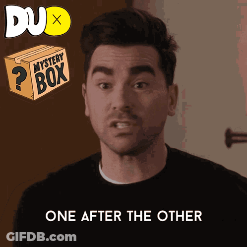 A Man Says One After The Other Next To A Box That Says Mystery Box GIF