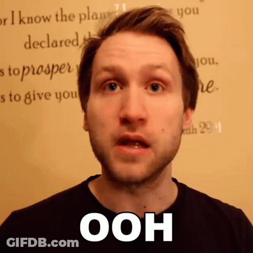 A Man Says Ooh In Front Of A Wall GIF