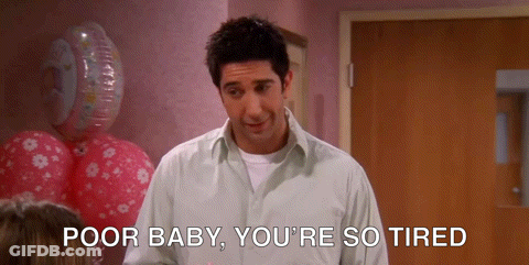 A Man Says Poor Baby You 'Re So Tired While Standing In Front Of Balloons GIF