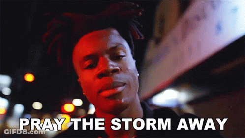 A Man Says Pray The Storm Away While Standing In Front Of A Building GIF