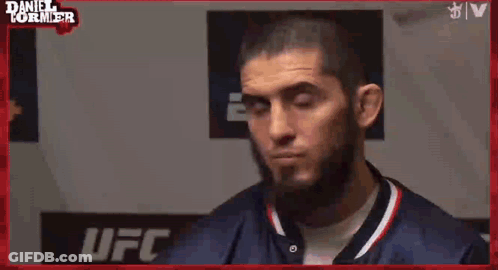 A Man Says " Put Him Ankalaev " In Front Of A Ufc Sign GIF